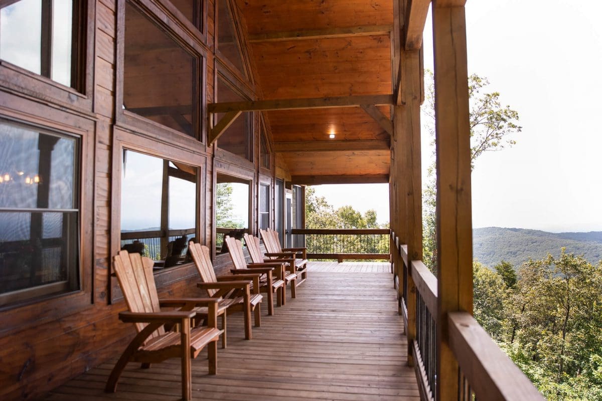 Beautiful wooden deck with chairs at a cabin