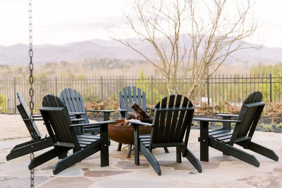 Adirondack chairs around a fireplace