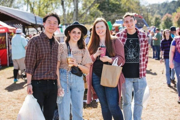 a couple enjoying food at the Apple Festival