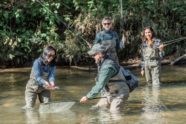 a group of friends catching a fish
