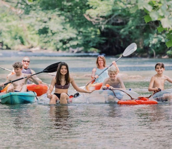 a family rafting and kayaking