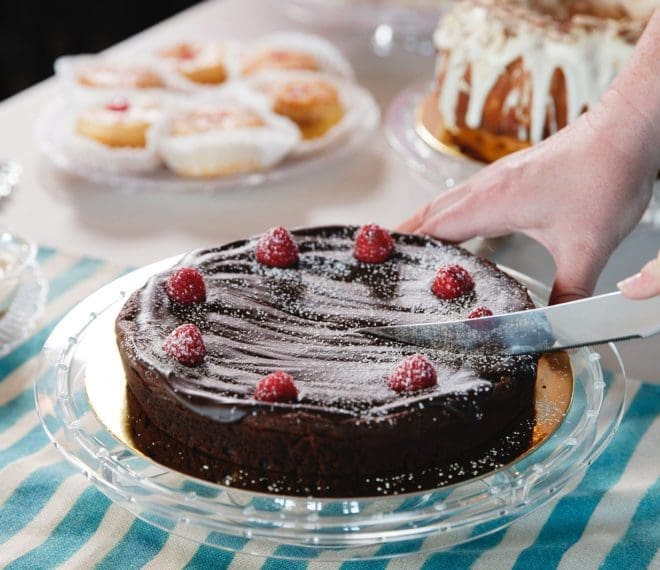 Cutting into a chocolate cake